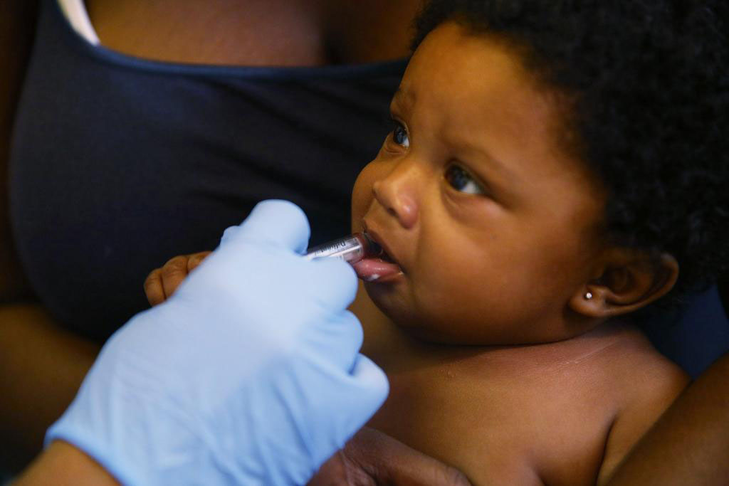 photo of child receiving an oral vaccine